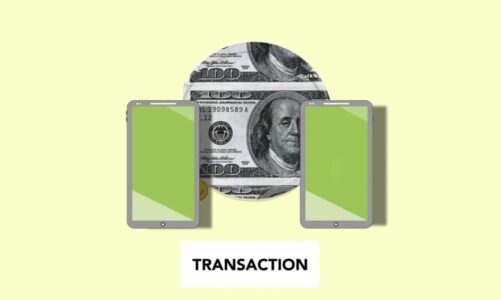 Dwa smartfony z zielonymi ekranami oraz banknot stu dolarowy z napisem TRANSACTION